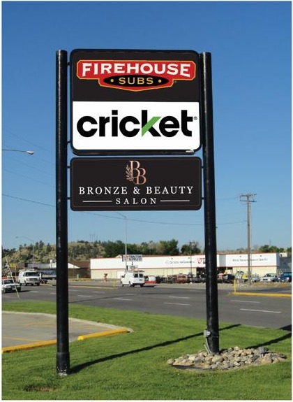 Preview of the Bronze and Beauty Salon roadside sign below Firehouse Subs and Cricket